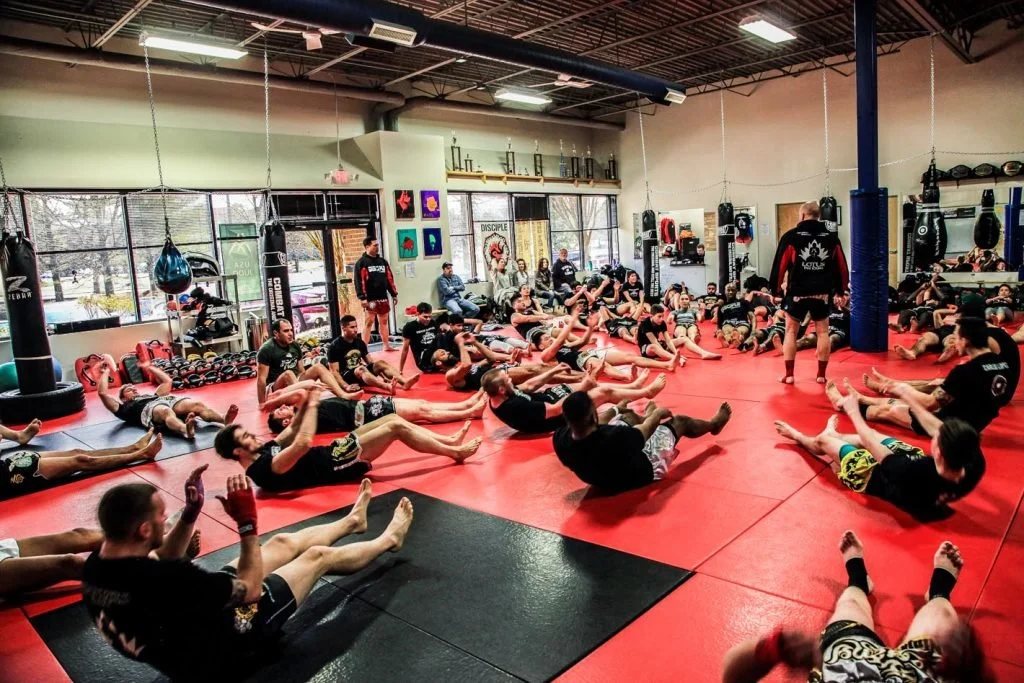 A full class training together on the main mat at Disciple MMA Academy in Sterling, Virginia